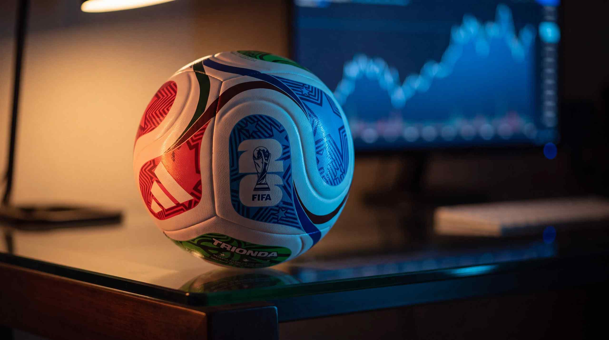 A 2026 World Cup football with a chart on a computer in the backroom.